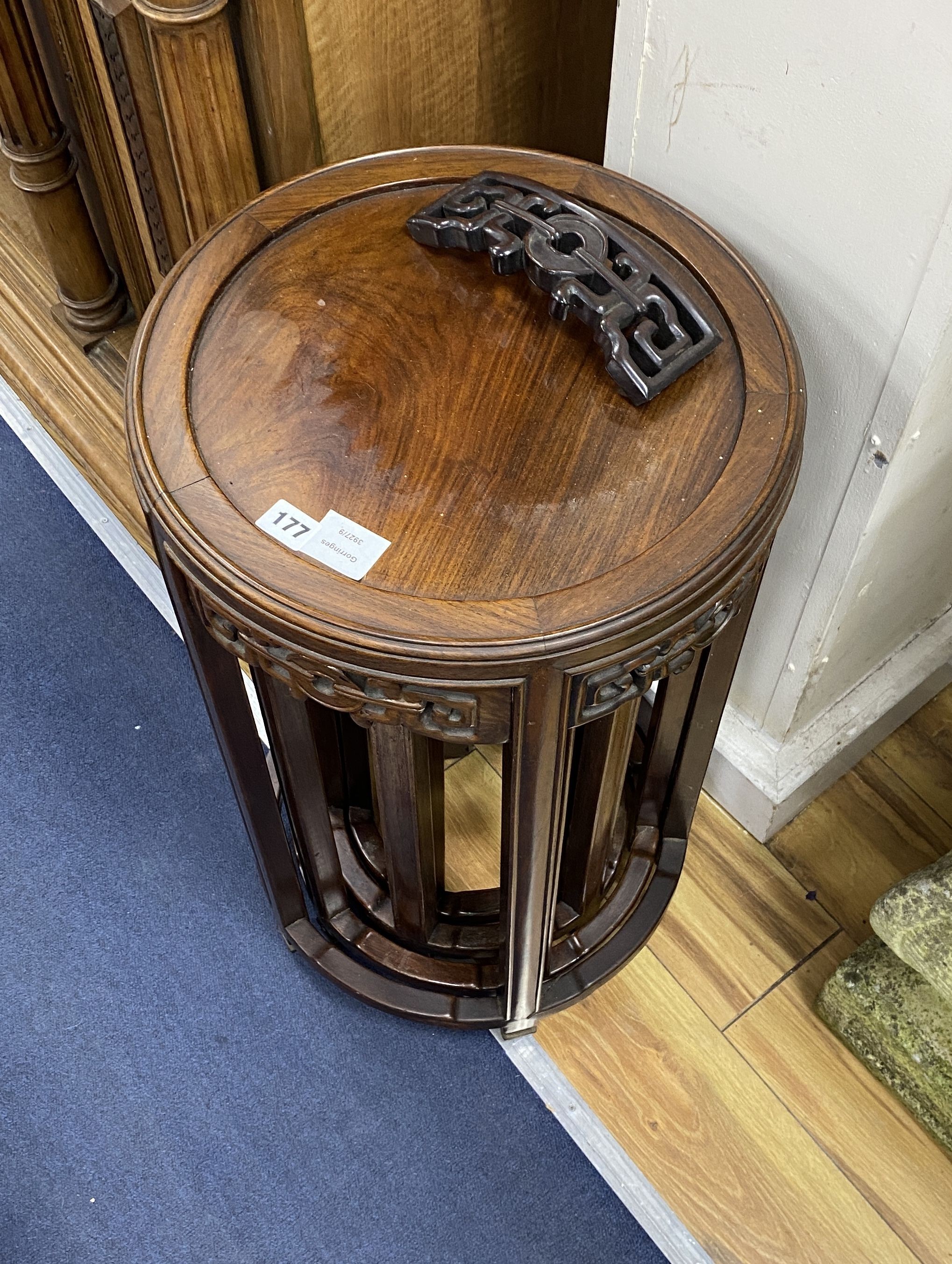 A nest of four Chinese hardwood circular tables, largest diameter 40cm, height 67cm